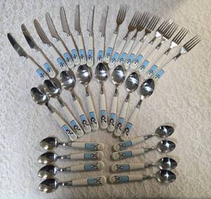 Service for Eight Cutlery  (knives, forks and spoons).  The handles feature snowmen.&nbsp&nbsp