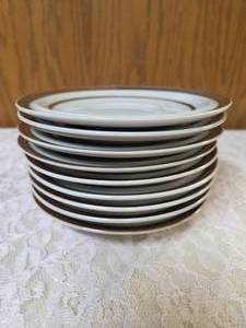Nine - vintage Sierra Stoneware saucers featuring a brown rim and ring design, likely produced by M S I Japan.&nbsp