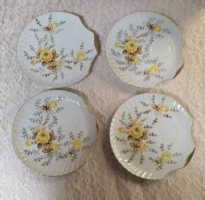 Four - vintage Japanese China snack sets featuring yellow roses with graybrown foliate and gold gilded rims.