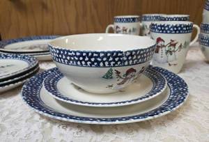 Vintage dinnerware set with 4 place settings is made by Thomson Pottery .  This set  is Snowman Winterland Blue Sponge. Each place setting includes a dinner plate, salad plate, bowl and a mug.&nbsp&nbsp