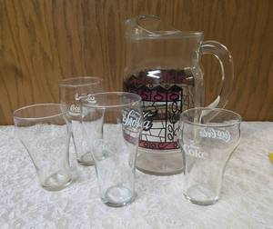Four Vintage Coco-Cola glasses and Coca-Cola Tiffany-style stained glass Pitcher.&nbsp&nbsp