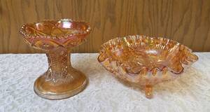 Two Vintage Imperial Carnival Glass.  The dish on the left is a pedestal compote or punch bowl base and the piece on the right is a ruffled edge serving  bowl or fruit dish.  The items are a marigold (iridescent orange) color.&nbsp