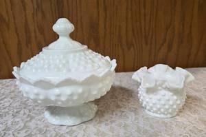 Vintage Fenton hobnail milk glass set features a lidded compote or candy dish and a matching smaller bowl .  The smaller bowl is 2 12 Tall.  Popular throughout the mid-20th century.&nbsp