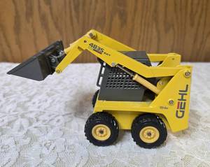 125 scale diecast model of a Gehl 4835 skid loader. The brand is Joal and the Manufacturer is Die-Cast Promotions (DCP) or NZG.&nbsp