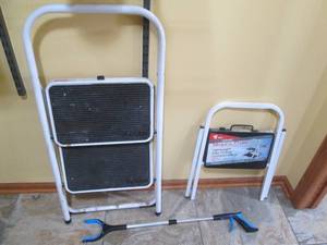 Assorted size step stools and a hel...