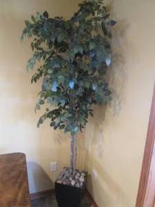 7 Foot decorative faux tree in pla...