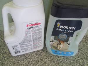 Full and partial jugs of ice melt...