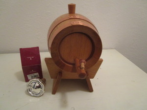 Keg on stand with silver cork circa...
