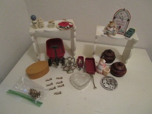 White stands and trinkets...