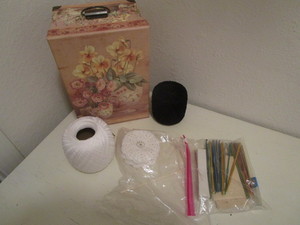 Crochet needles, thread and coaster...