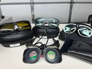 Lot of 4 Laser Safety Glasses -premium brands like NoIR &amp Phillips. These goggles block harmful invisible light, keeping eyes safe during DIY laser work. Features mixed protection levels &amp cases. Used Condition May have cracks in lens -see pics