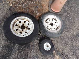 Pair of 4 hole 12 Trailer Tires and small tire