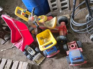 Lot of Childrens Toys Including Ride-On Tricycle, Toy Trucks, and Toy Lawn Mower