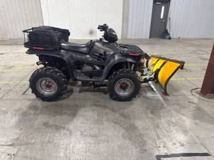Polaris Sportsman ATV with Plow