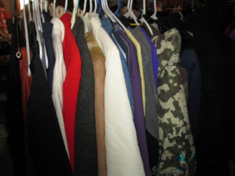 Lot of assorted clothing and hanger...