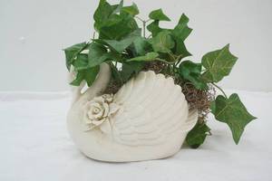 ceramic planter with artificial flowers