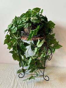 Variegated Faux Pothos Plant in Wicker Basket on Black Metal Plant Stand
