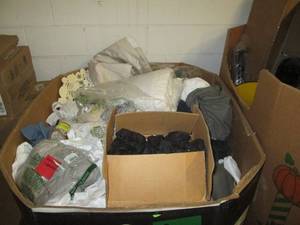 Pallet of assorted clothes and bedd...