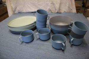 Plastic oval plates, mugs, and serv...