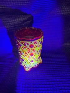Red glass votive with uranium glass