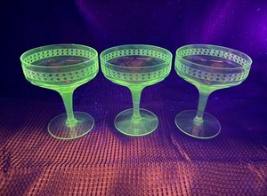 Needle etched crystal champagne coupes that glow