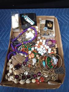 Flat of jewelry including sterling silver, Black hills gold necklace and Arlo Artwork