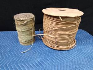Roll of twine and large roll of paper twine