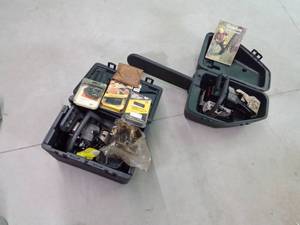 Craftsman and a Ryobi chainsaws for parts in cases with 6 chainsaw chains and chainsaw service manual