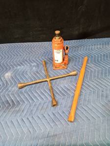 6 Ton hydraulic bottle jack and a 4-way wrench