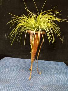 Metal plant stand with artificial plant