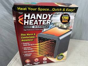 New Handy Heater Pure Warmth Ceramic Space Heater with LED Lights