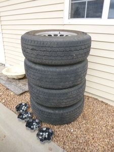 4 GMC 22 Sierra Tires on Rims with Hubcaps
