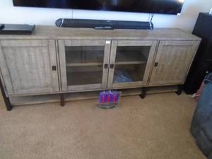 Rustic style entertainment center. As shown. CASH ON SITE ONLY. PICKUP IS MONDAY MAY 11TH FROM 11 AM TO 4 PM. REGARDLESS WHAT THE SCHEDULE STATES.