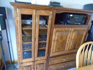 Oak entertainment center. No accessories included. As shown. CASH ON SITE ONLY. PICKUP IS MONDAY MAY 11TH FROM 11 AM TO 4 PM. REGARDLESS WHAT THE SCHEDULE STATES.