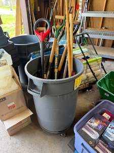 Garbage Can Full of Good Yard Tools Shovels etc