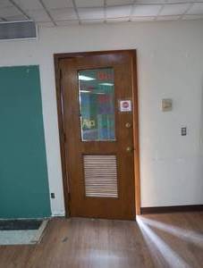2 WOOD DOORS  LOUVERS   (RESOURCE ROOM)