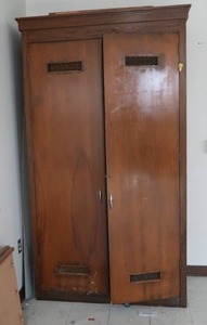 TALL WOODEN STORAGE CABINET (CLOSE TO KITCHEN)
