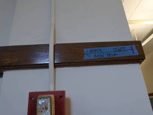 APPROX150 OF ANTIQUE TRIM BOARD IN HALLWAY.R220