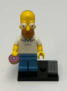 Collectible Hard To Get HOMER SIMPSON Genuine Lego Mini figure With Donut, TV Remote And Stand