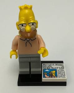 RARE Collectible Hard To Get GRAMPA SIMPSON Genuine Lego Mini figure With Newspaper And Stand