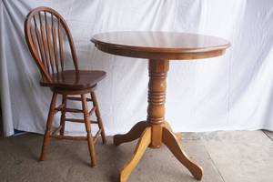 Wooden High-Top Pedestal Table and 1 Chair. 36 diameter by 37 tall