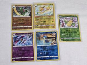 Lot of 5 Holo Pokemon Trading Cards featuring Malamar, Flygon, Lapras, Jolteon, and Victreebel