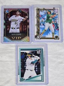 Lot of 3 Nick Kurtz Rookie Cards featuring Bowman Chrome VIP, Topps Holiday, and Donruss Rated Prospect.