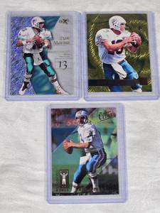 Lot of 3 Dan Marino Football Cards including Premium Fleer Ultra and EX-2000 Inserts.