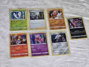 Lot of 7 Holo Pokemon Trading Cards Featuring Entei, Butterfree, Tapu Lele, Landorus, Aggron, Hoopa, and Professors Research Trainer Card