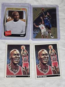 Lot of 4 Michael Jordan Basketball Cards including Fleer Hanes and Vintage Style Cards.