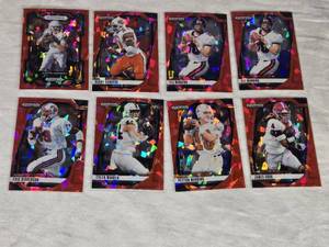 Lot of 8 Ruby Cracked Ice Prizm Football Cards Featuring Eli Manning, Peyton Manning, Justin Herbert, Barry Sanders, Eric Dickerson, Tyler Warren, and James Cook