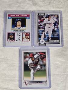 Lot of 3 Shohei Ohtani Baseball Cards Including Home Run Leaders and Designated Hitter Cards with Topps Heritage and Dodgers Features