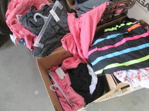 Box of brand new clothes, most have...