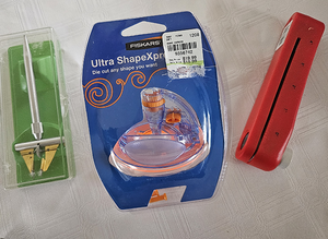 Includes NEW Friskars�Ultra ShapeXpro�circle cutter and two sets of new blades a double scoring tool, and a hole punch.